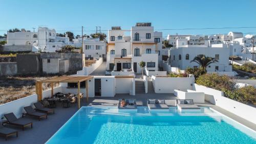 a view of a villa with a swimming pool at North Wind Luxury Suites in Oia