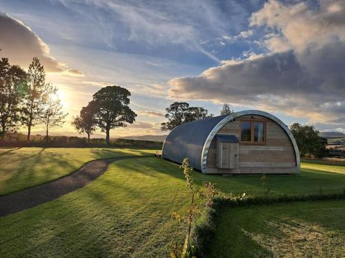 a large dome tent on a grass field at The Pigsty in Crieff