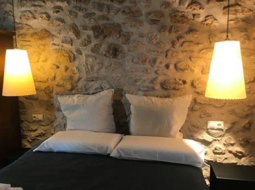 Posteľ alebo postele v izbe v ubytovaní Ca Margalef - Casa Rutal con Encanto