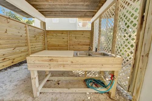 a wooden cabin with a sink in it at Casablanca - Beach home with heated pool, bikes and more, sleeps 13! in St. George Island