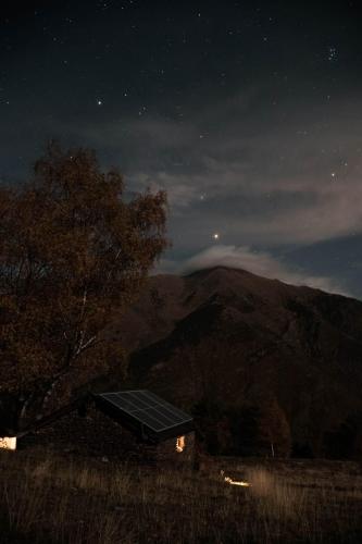 a solar panel on top of a house at night at Bordes Pirineu, Costuix in Areu