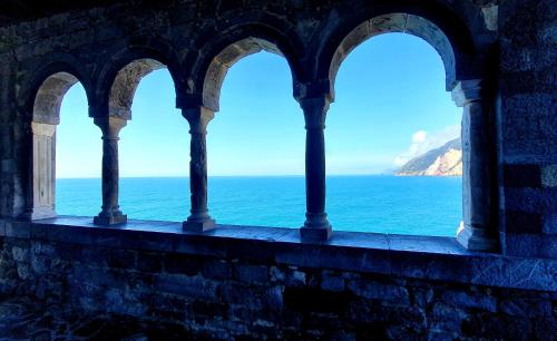 a view of the ocean from a castle window at L'Americano Luxury Rooms in Chiavari