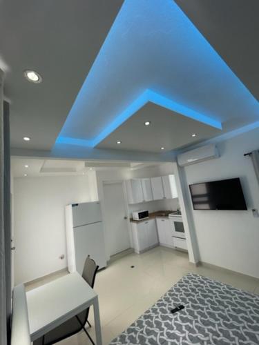 a ceiling with a blue light in a kitchen at 1058 Modern Apt 7 in San Juan