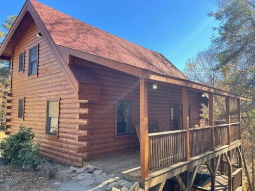 a log cabin with a porch and a deck at The Mountaineer Cabin Walk to Greenway 5min to ASU in Boone