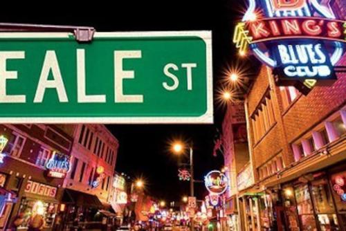 a street sign forale st on a city street at night at Historic Details Modern Updates in Prime Location in Memphis