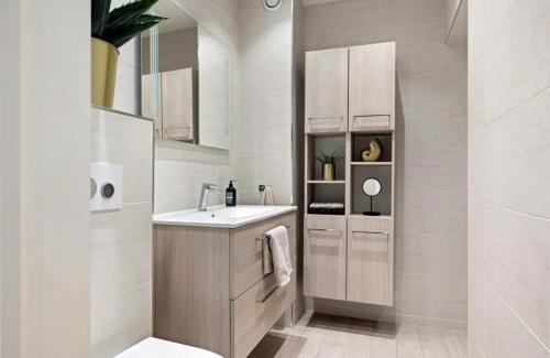 a bathroom with a sink and a mirror at Private room in heart of Oslo Grunerløkka in Oslo