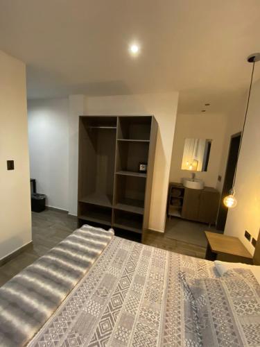 a bedroom with a large bed in a room at Quinta del sol in Chihuahua