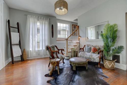 a living room with a couch and a chair at Walk to Overton Square from your Historic Retreat in Memphis