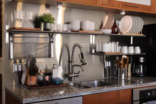 a kitchen with a sink and a counter top at NEW! Lavish Studio Loft in Central Downtown SLC in Salt Lake City