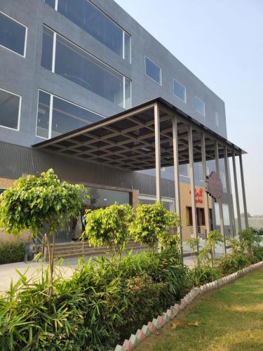 a building with awning in front of it at Bellazio Suites Hotel & Resort in Bareilly