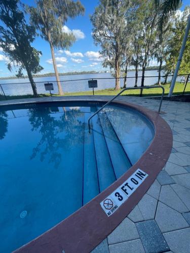 a swimming pool with a sign that reads braid at Disney 1 mile , Blue Heron 1 room 2 bath,amenities,6 guests, walk to restaurants, no fees at check in in Orlando