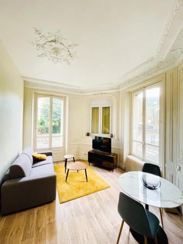 Coin salon dans l'établissement Appartement cosy proche gare avec stationnement gratuit