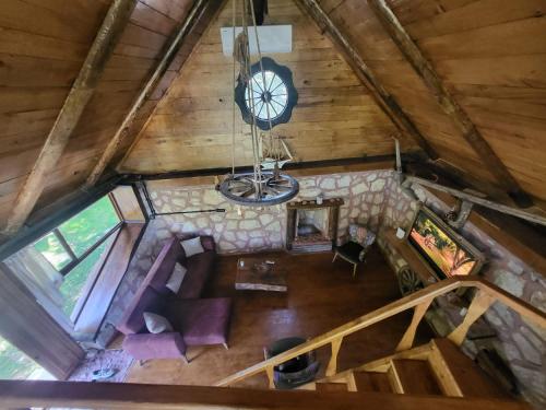 an overhead view of a living room with a clock at TAŞ_SUİT in Kartepe