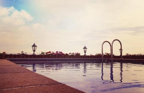 a pool of water with two metal bars in it at Spa Complejo Rural Las Abiertas in San Bartolomé de las Abiertas