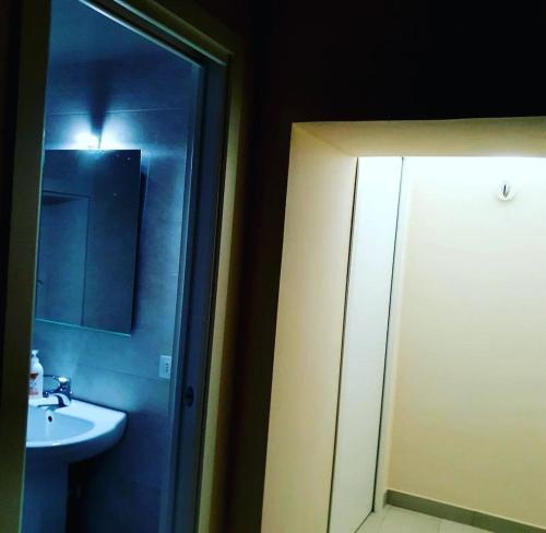a bathroom with a sink and a mirror at SPARTA in Ercolano