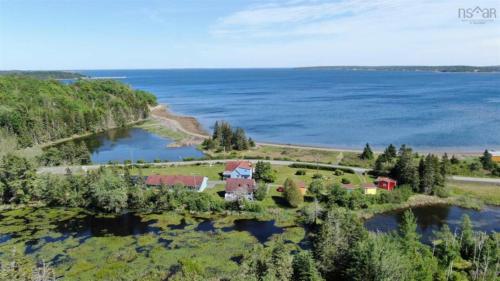 an aerial view of a house on an island in the water at Atlantic View Motel in Lunenburg