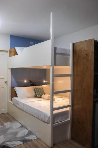 a couple of bunk beds in a room at The Beach House in El Nido