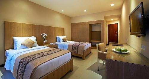 Ένα ή περισσότερα κρεβάτια σε δωμάτιο στο Berjaya Hotel Colombo
