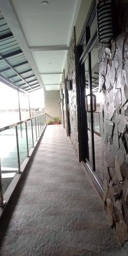 a hallway of a building with a stone wall at Regal425 Condotel in Angeles
