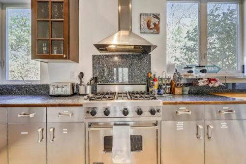 a kitchen with a stainless steel stove top oven at The Great Escape - Hamptons Serene Family Favorite in Sagaponack