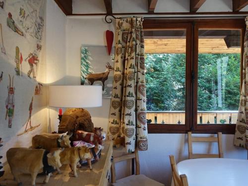 a room with a table with stuffed animals on it at Chalet pour 14 personnes avec terrasse au cœur d'Arêches-Beaufort - FR-1-342-294 in Beaufort