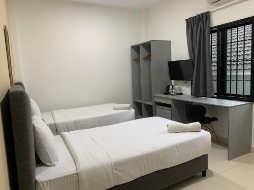 Pusat Belia Antarabangsa tesisinde bir odada yatak veya yataklar