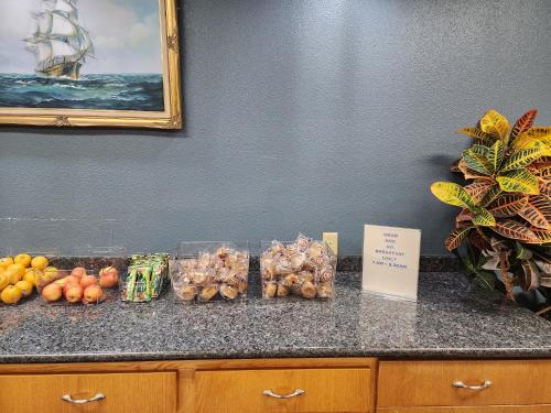 a counter with a bunch of fruits and vegetables on it at Anchor Beach Inn in Crescent City