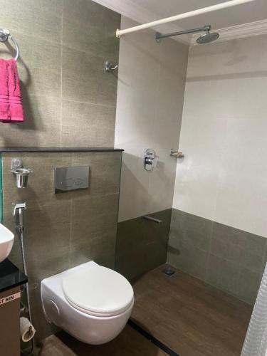 a bathroom with a toilet and a shower at Sajhome Fortkochi, Kochi, Kerala, inda in Cochin
