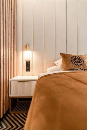 Cama o camas de una habitación en Aparthotel Zakopane