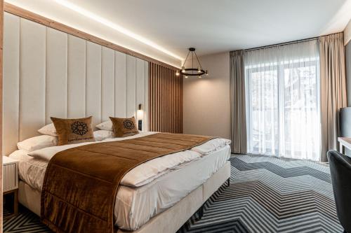 Cama o camas de una habitación en Aparthotel Zakopane