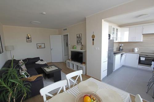 a living room with a couch and a table at SuperB apartment with incredible view at the best location in Veszprém