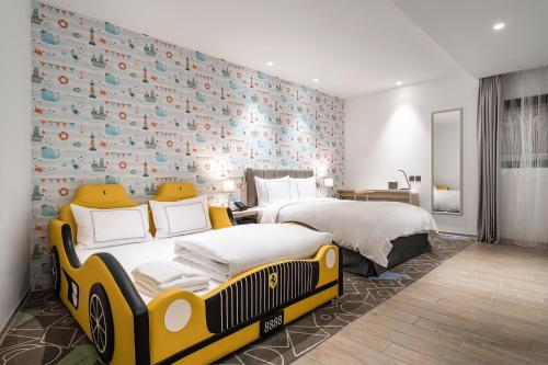 Un ou plusieurs lits dans un hébergement de l'établissement Phoenix Hotel Taichung