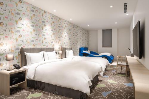 Un ou plusieurs lits dans un hébergement de l'établissement Phoenix Hotel Taichung
