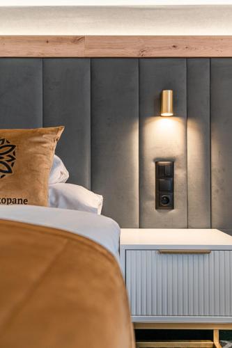 Cama o camas de una habitación en Aparthotel Zakopane