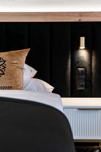 Cama o camas de una habitación en Aparthotel Zakopane