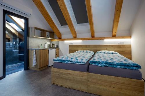Postel nebo postele na pokoji v ubytování Penzion Kunc - Ubytování v soukromí - Borová 607, Příbram - Střední Čechy