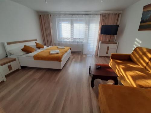 Postel nebo postele na pokoji v ubytování Willa Rosa-apartamenty z prywatną sauną