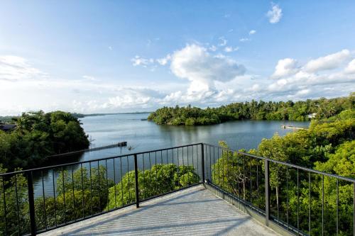 a view of a river from a balcony at Splendour Residence in Balapitiya