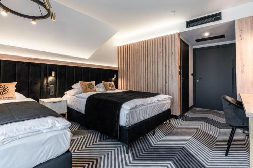 Cama o camas de una habitación en Aparthotel Zakopane