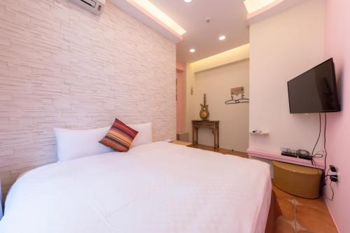 Televisyen dan/atau pusat hiburan di Rococo Homestay