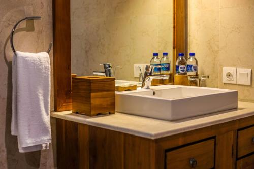 a bathroom with a sink and a mirror at BB Resort Villa and Spa in Nusa Penida