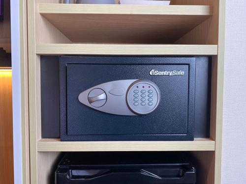 a safe with a computer mouse on top of it at CHISUN PREMIUM Kyoto Kujo in Kyoto