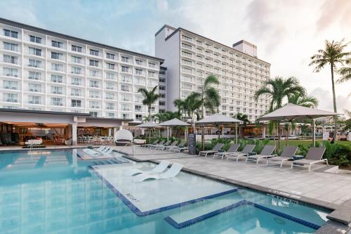 a view of the hotel from the pool at Crowne Plaza Resort Guam in Tumon