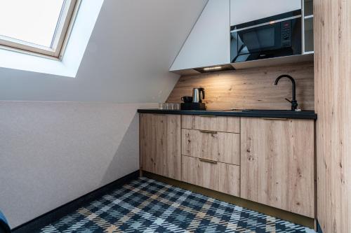 Una cocina o zona de cocina en Aparthotel Zakopane
