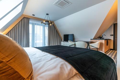 Cama o camas de una habitación en Aparthotel Zakopane