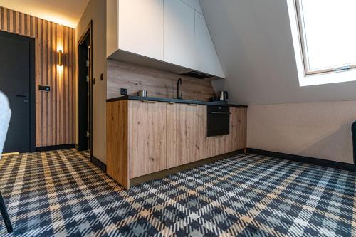 Una cocina o zona de cocina en Aparthotel Zakopane