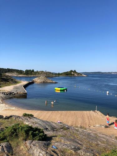 a group of people swimming in a body of water at Kristiansand Feriesenter in Kristiansand