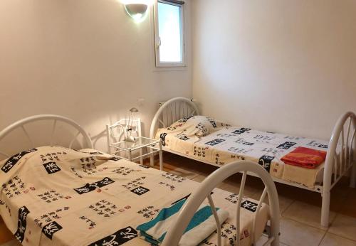 Postel nebo postele na pokoji v ubytování Villa Athena