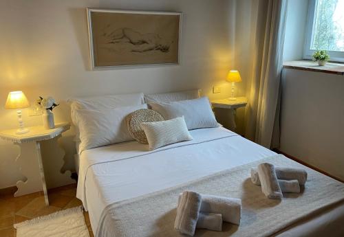 Letto o letti in una camera di Relais Il Pozzeto