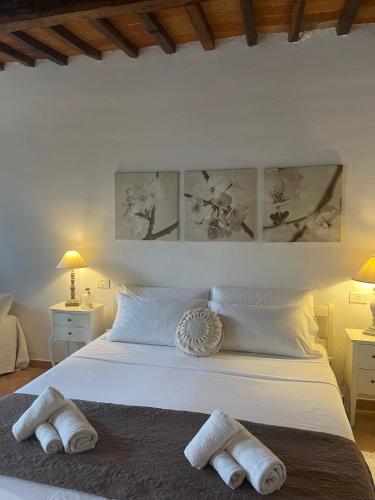 Letto o letti in una camera di Relais Il Pozzeto